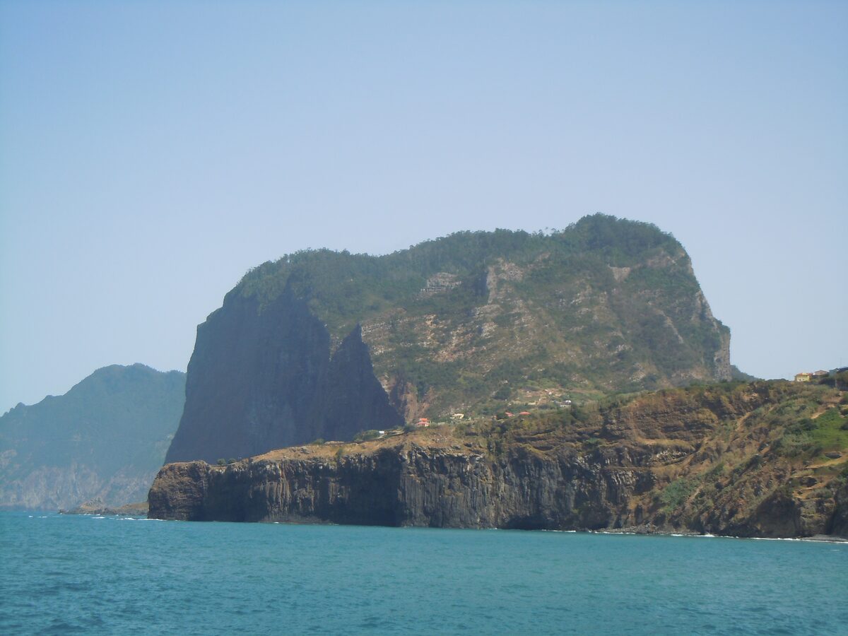 The rocky Penha d'Águia pinnacle rising above the sea on the north-east coast