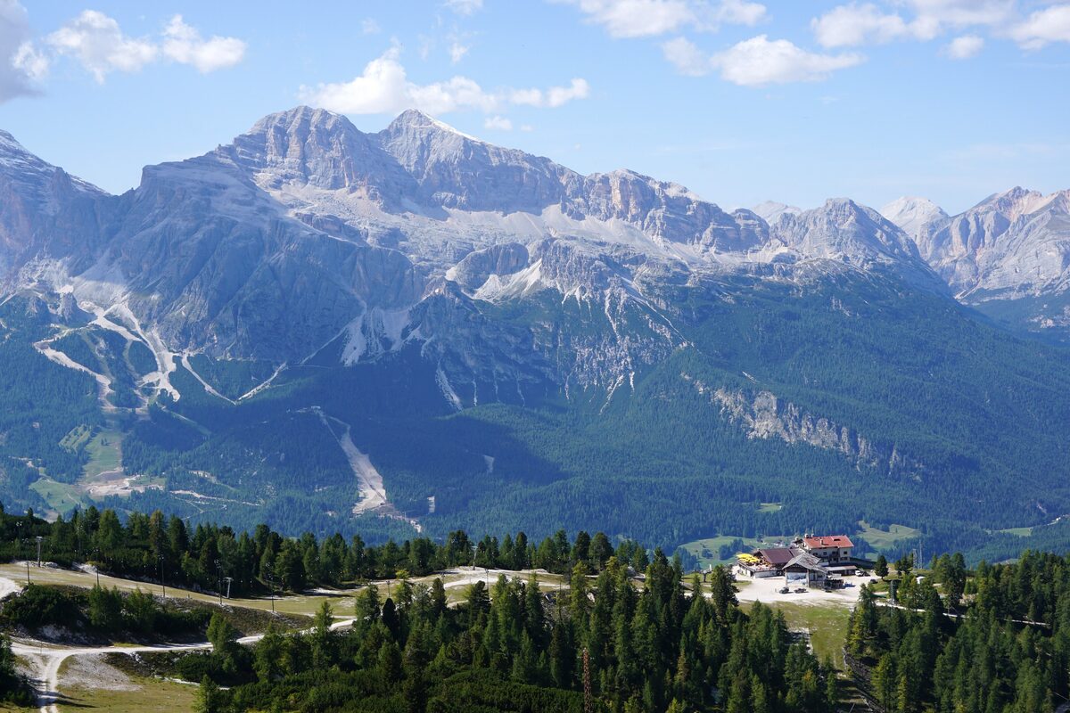 The Faloria ridge above Cortina d'Ampezzo in summer, with jagged peaks and forest below
