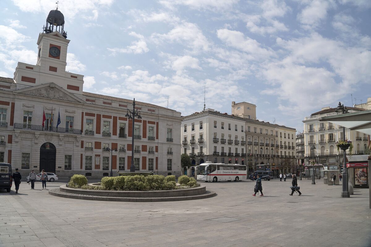 The Real Casa de Correos with its clock tower on the Puerta del Sol, with a wide square in front