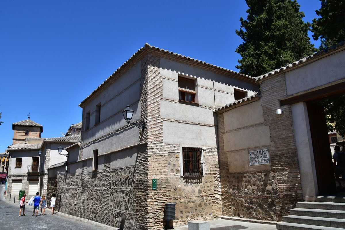The plain brick and stone walls of Santa María la Blanca, the former synagogue, on a quiet street