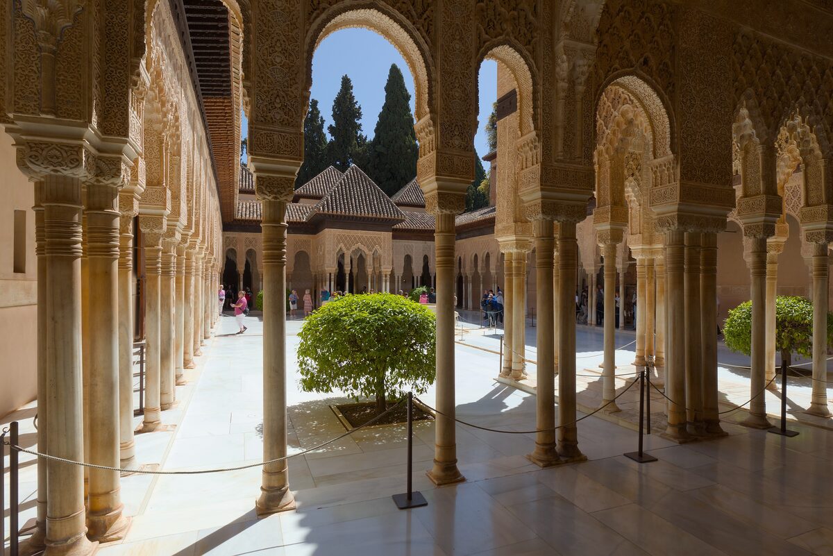 Carved arcades and slender columns around the Court of the Lions in the Alhambra