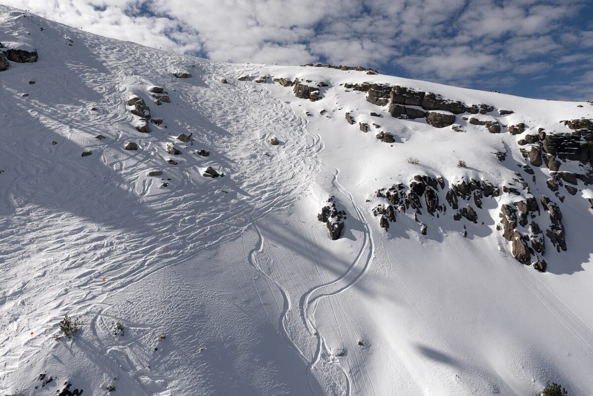 Ski tracks across a steep, rocky slope on Mammoth Mountain