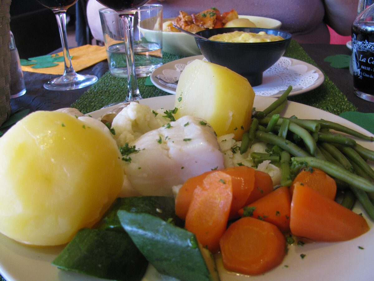 A plate of aïoli garni with poached salt cod, potatoes and carrots