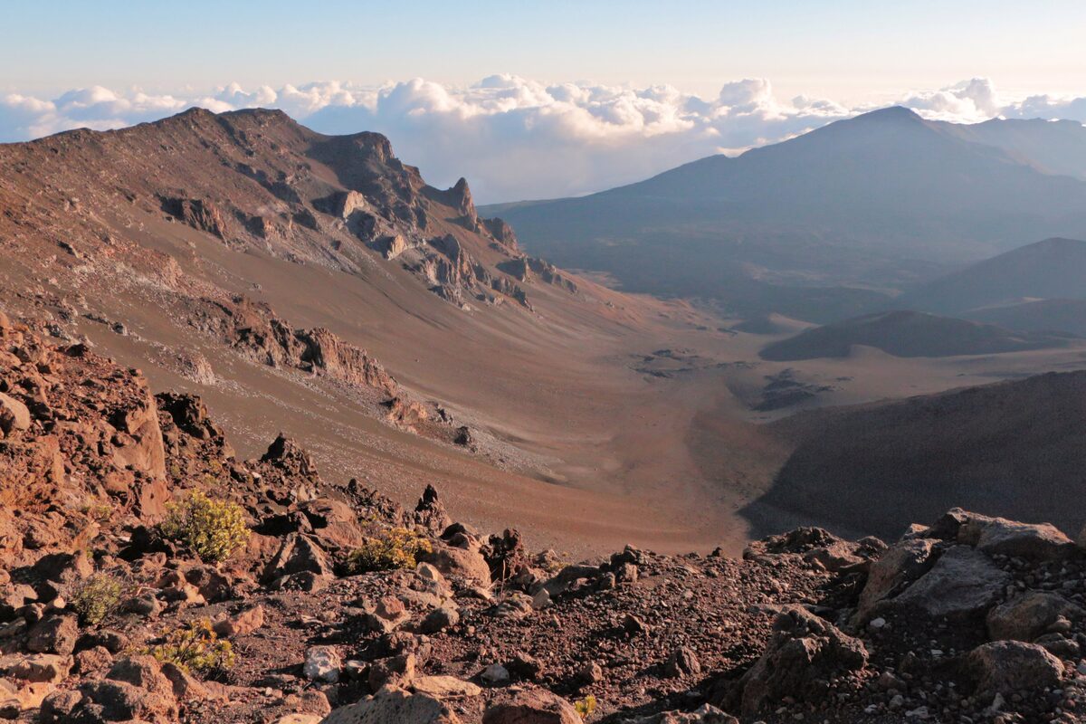 Red cinder slopes and the crater of Haleakalā in early morning light