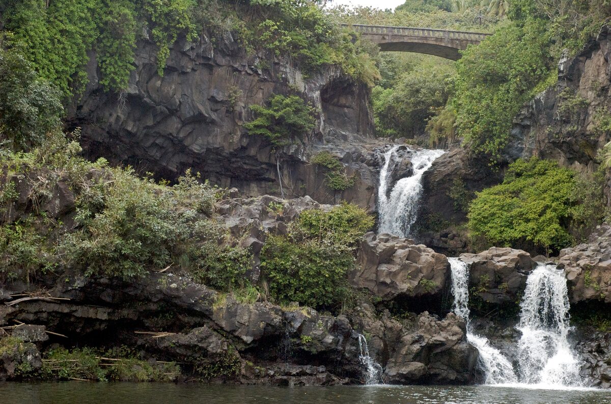 Waterfalls tumbling into the pools of ʻŌheʻo Gulch below the Hāna Highway bridge