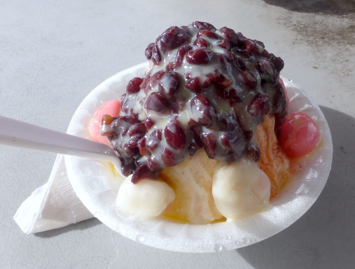 A bowl of Hawaiian shave ice topped with sweet red beans and mochi