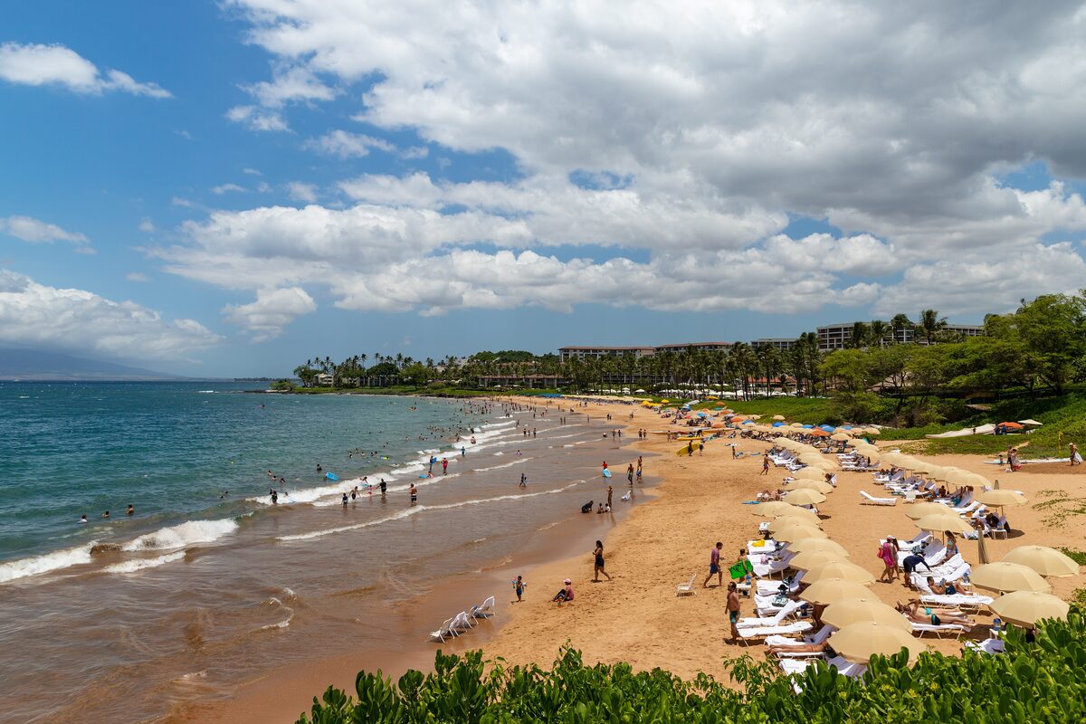 Wailea Beach with a long golden shore and clear water under blue sky