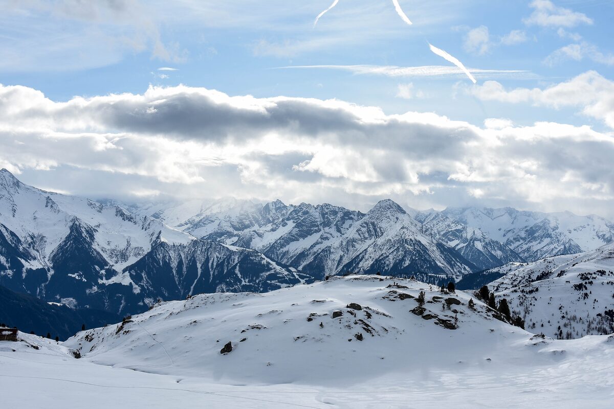 Snow-covered peaks of the Tux Alps seen from the Hochfügen-Hochzillertal ski area on a bright January day