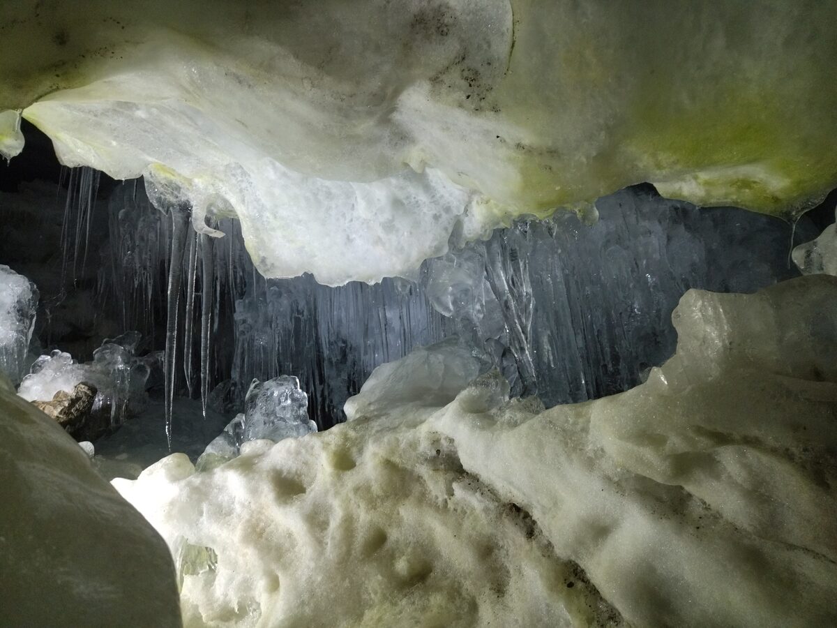 Icicles hanging from the ice ceiling and ice walls inside the Natur Eis Palast ice cave on the Hintertux Glacier