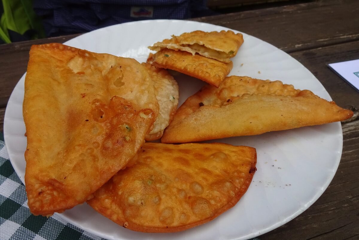 Zillertaler Krapfen, golden fried pastry pockets on a white plate