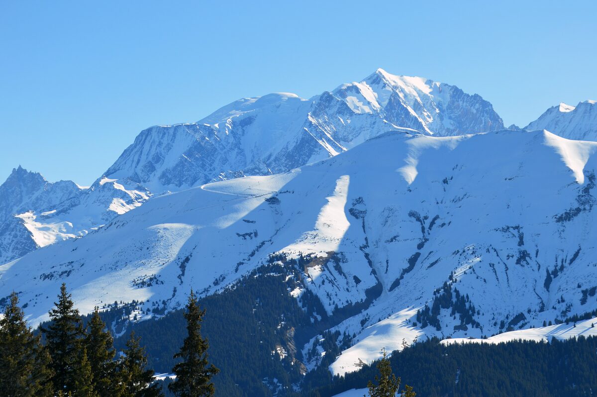 Snowy ridges of the Mont Blanc massif seen from the L'Alpette sector above Megève