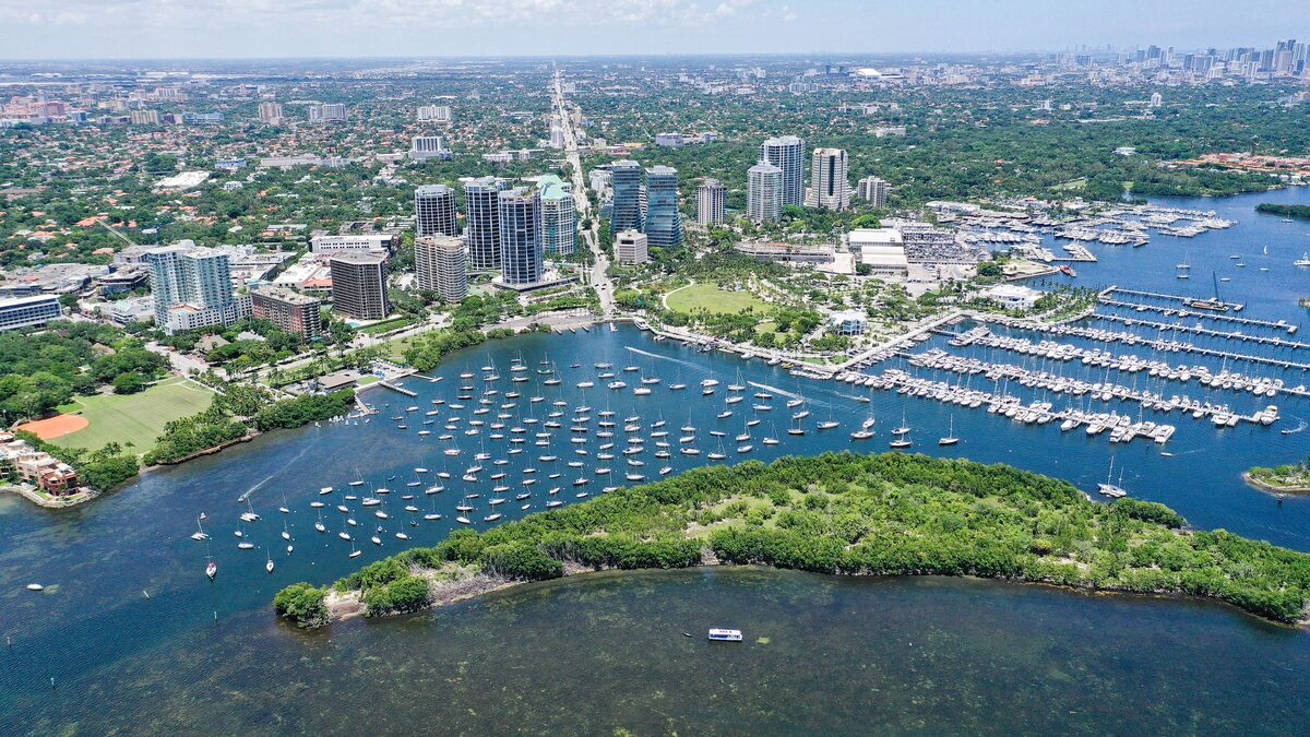 Aerial view of Coconut Grove, with the marina and moored boats on Biscayne Bay and the towers of the Grove behind