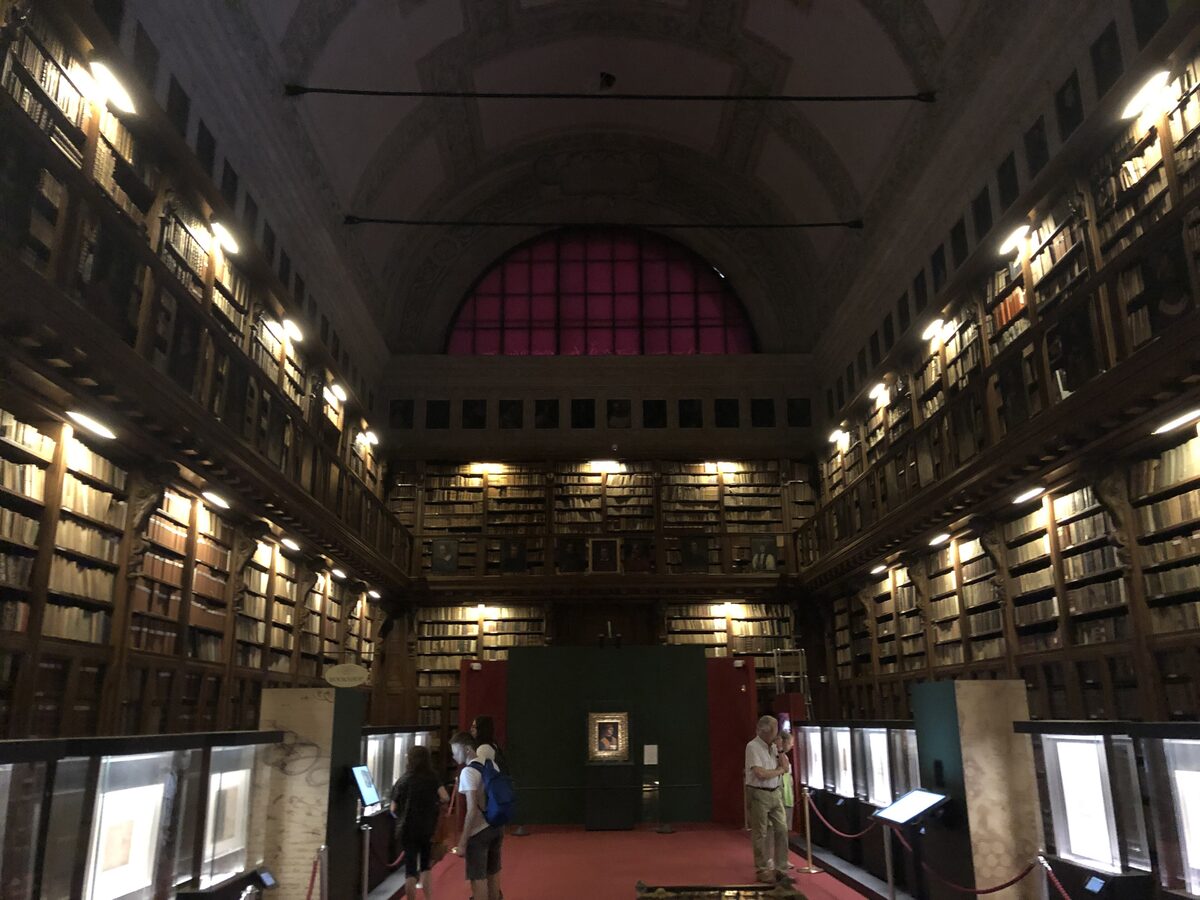 Bookshelves and a reading room in the Ambrosiana library