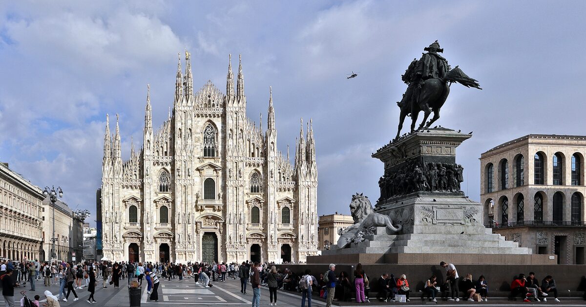Milan Cathedral's white marble facade and the Vittorio Emanuele II statue