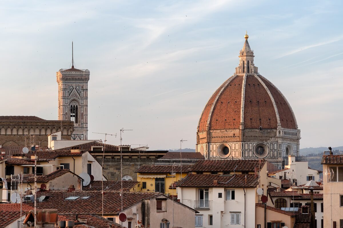 The dome of Florence Cathedral and Giotto's bell tower over the rooftops