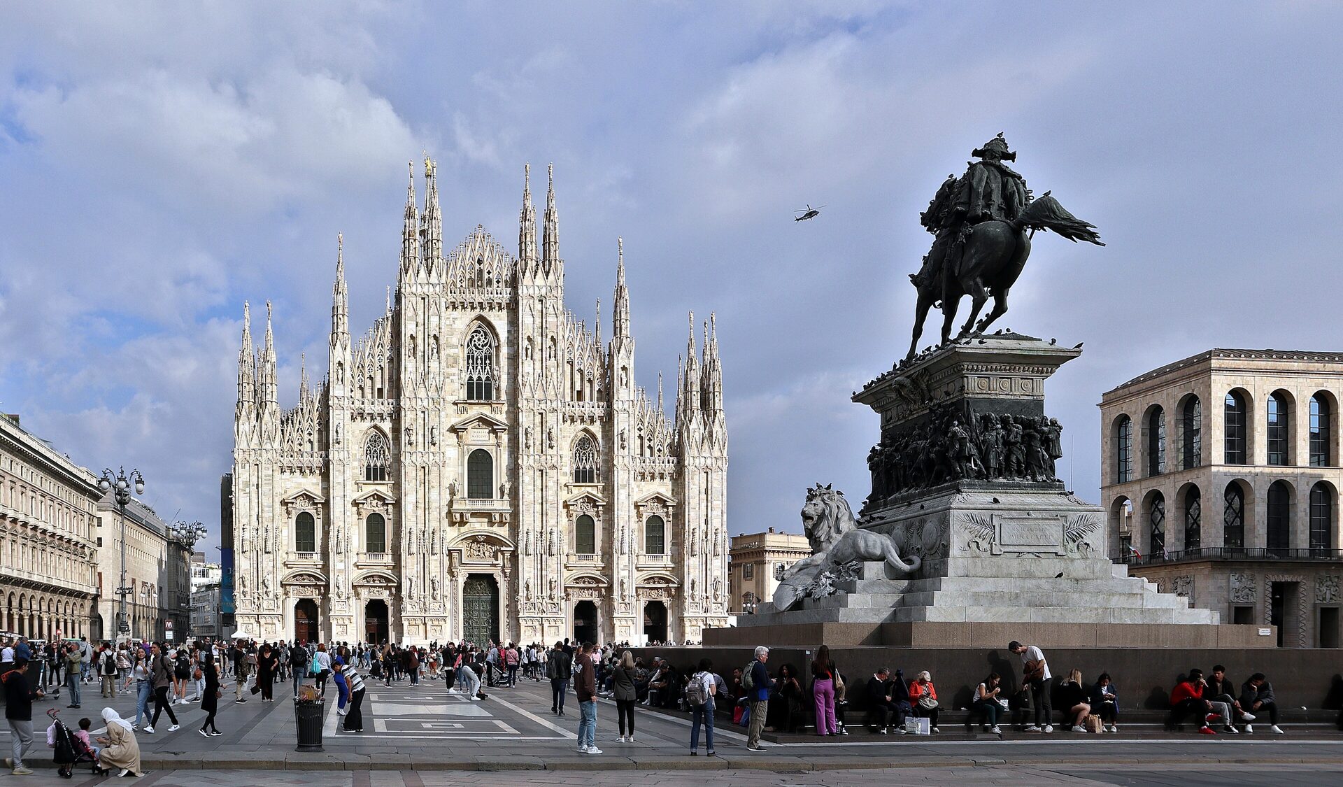 Milan Cathedral's white marble facade and the Vittorio Emanuele II statue