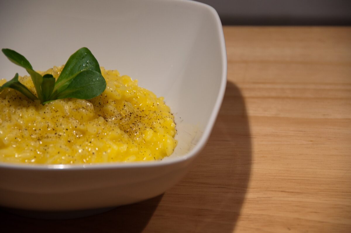 Saffron risotto in a white bowl