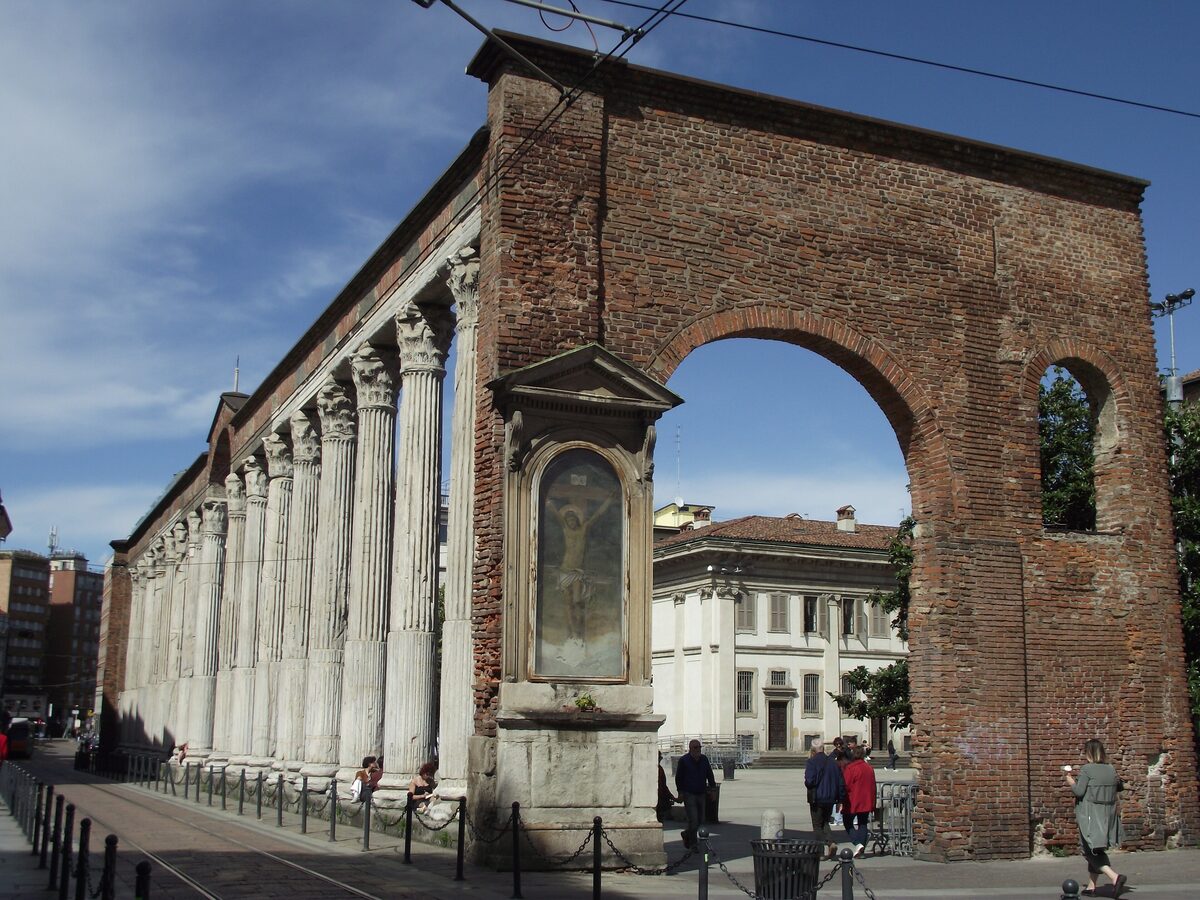 The Roman columns of San Lorenzo beside a brick arch