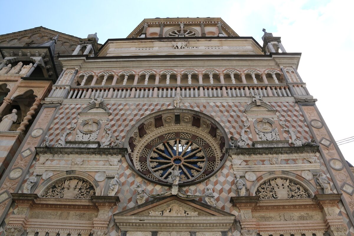 The Colleoni Chapel's pink and white marble facade, built onto Santa Maria Maggiore