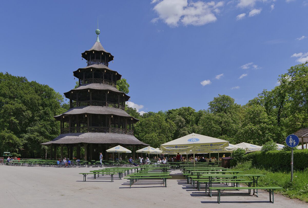 The five-tiered wooden Chinese Tower with the empty benches and umbrellas of its beer garden in front
