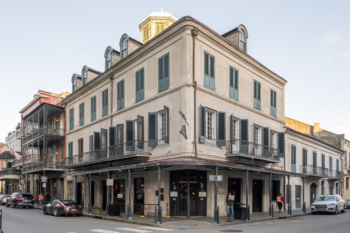 The Napoleon House, a three-story corner building with a cupola, shuttered windows and iron balconies in the French Quarter