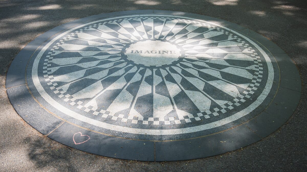 The black-and-white Imagine mosaic memorial set into the path at Strawberry Fields in Central Park