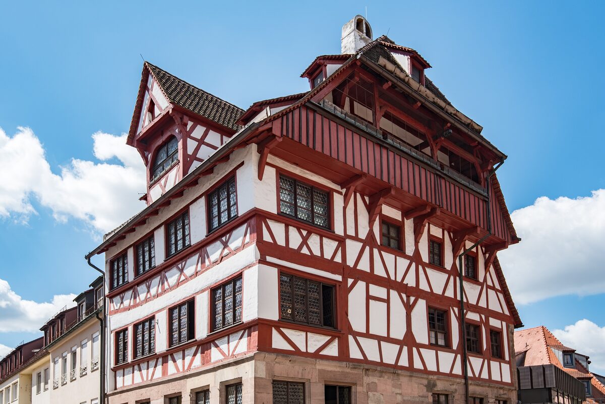 The half-timbered Albrecht-Dürer-Haus with its steep red-and-white upper floors
