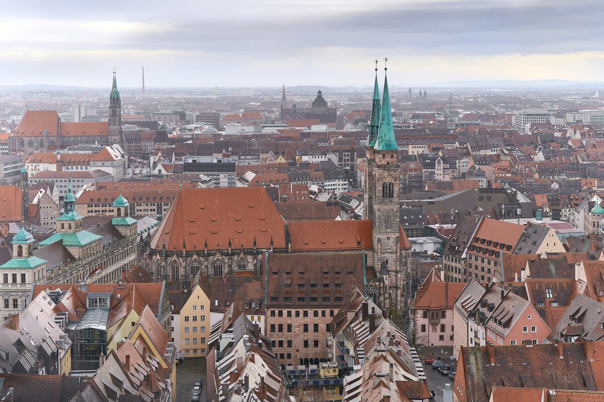 The twin green spires of the Sebalduskirche rising over the red roofs of the old town