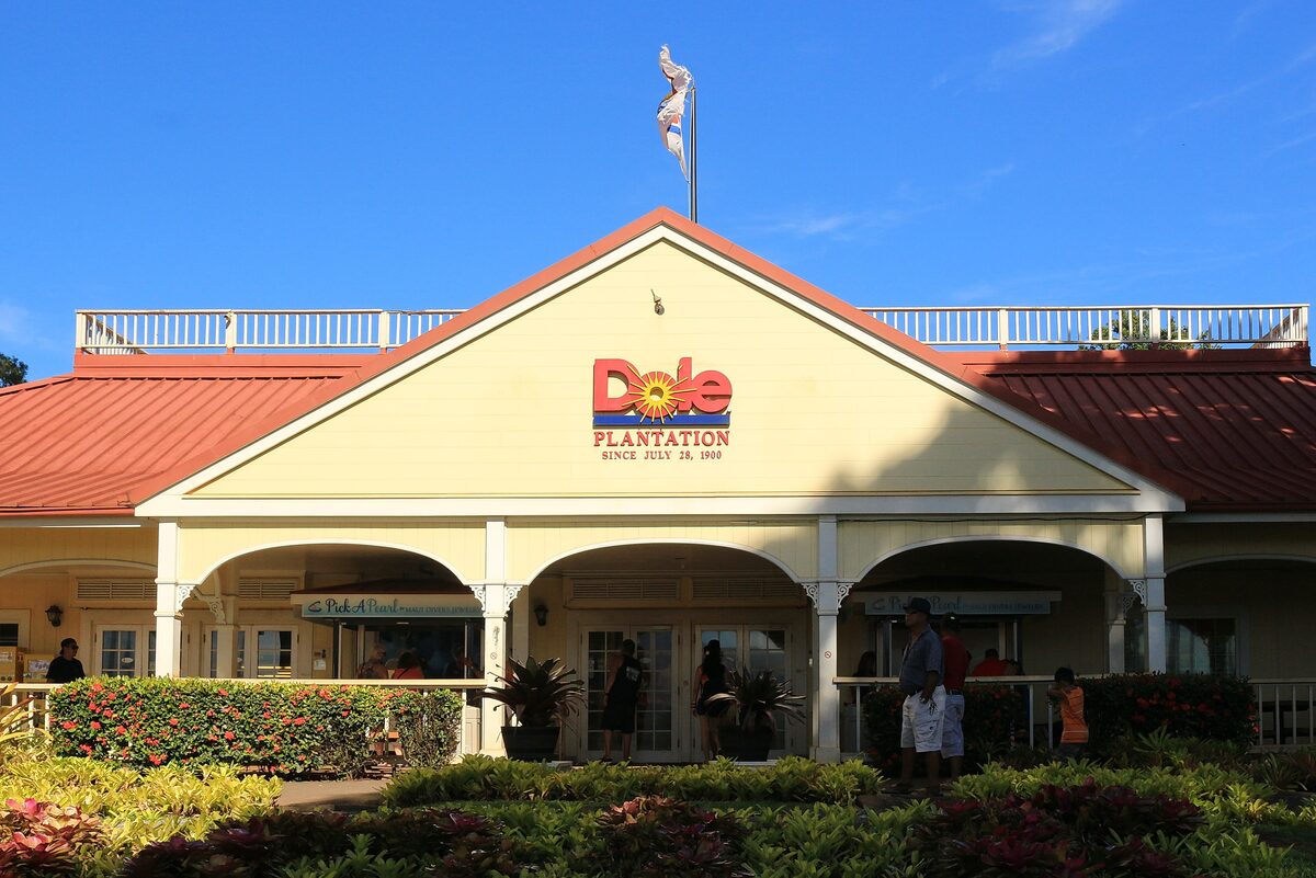 The Dole Plantation visitor building with its red roof and gardens