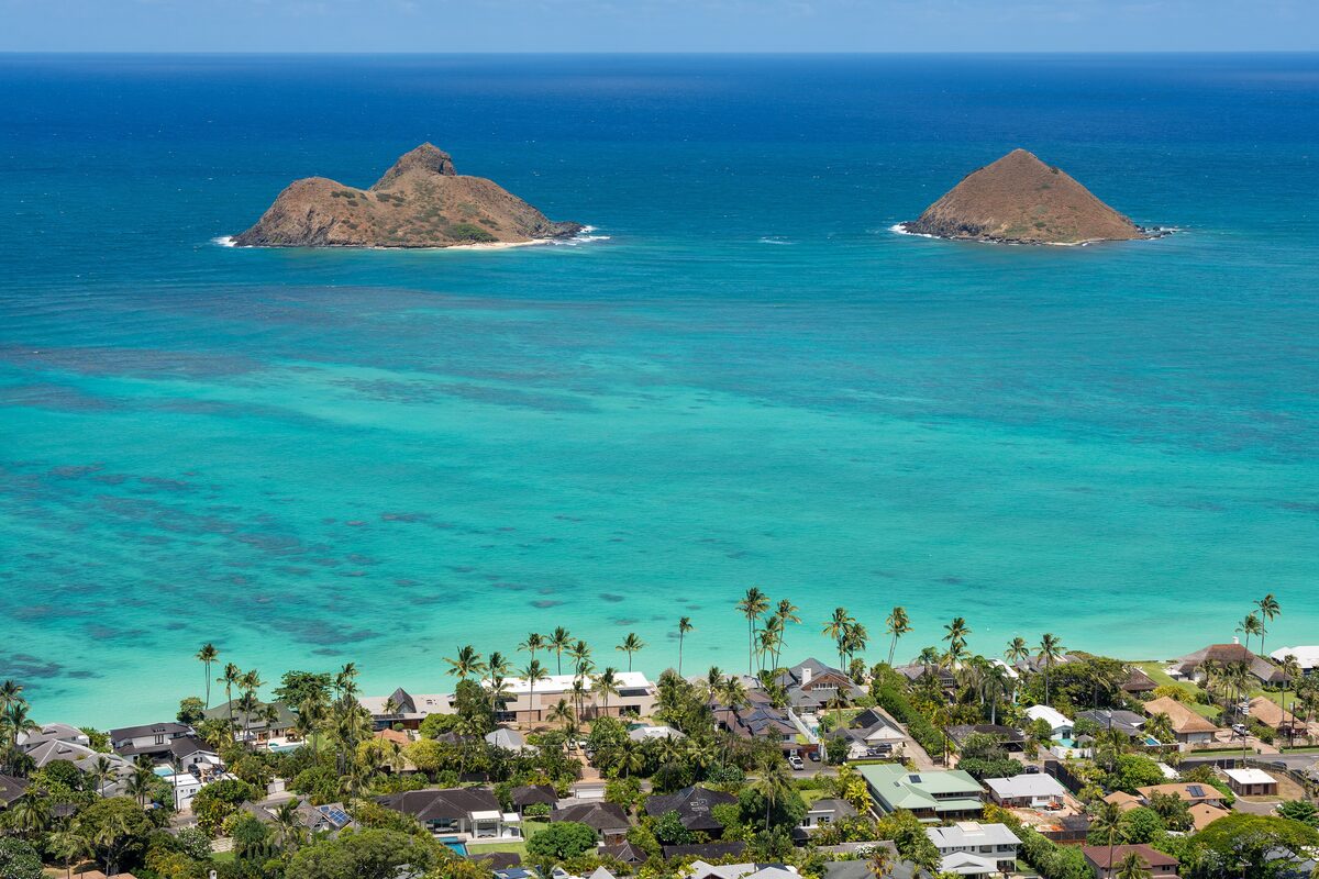 The Mokulua islands off Lanikai's turquoise water and palm-lined houses