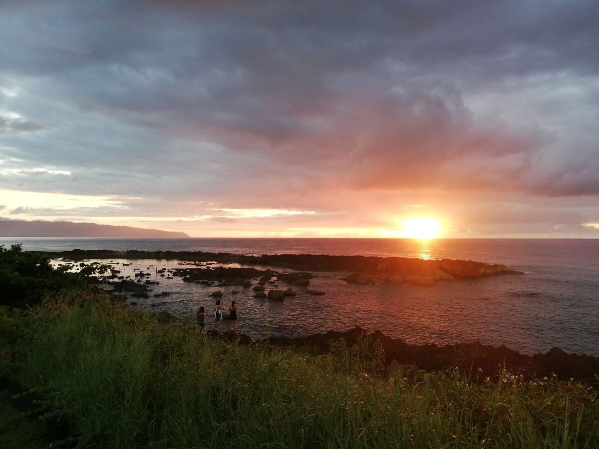 Sun setting over the rocky tide pools of Shark's Cove
