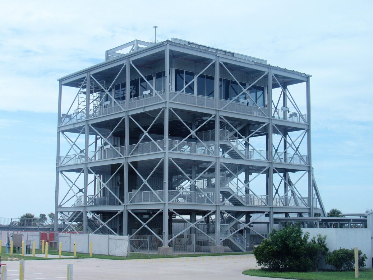 Steel observation gantry tower at LC-39 under a pale sky