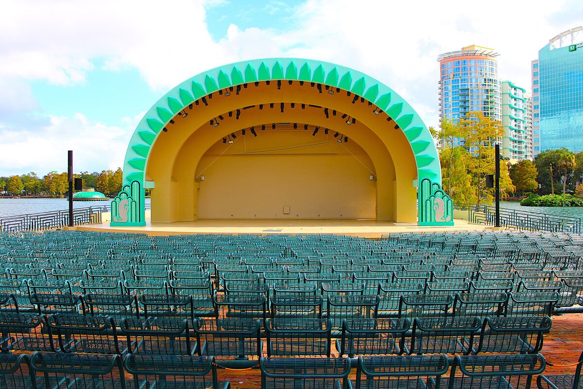 Walt Disney Amphitheater's teal and gold shell over empty seats