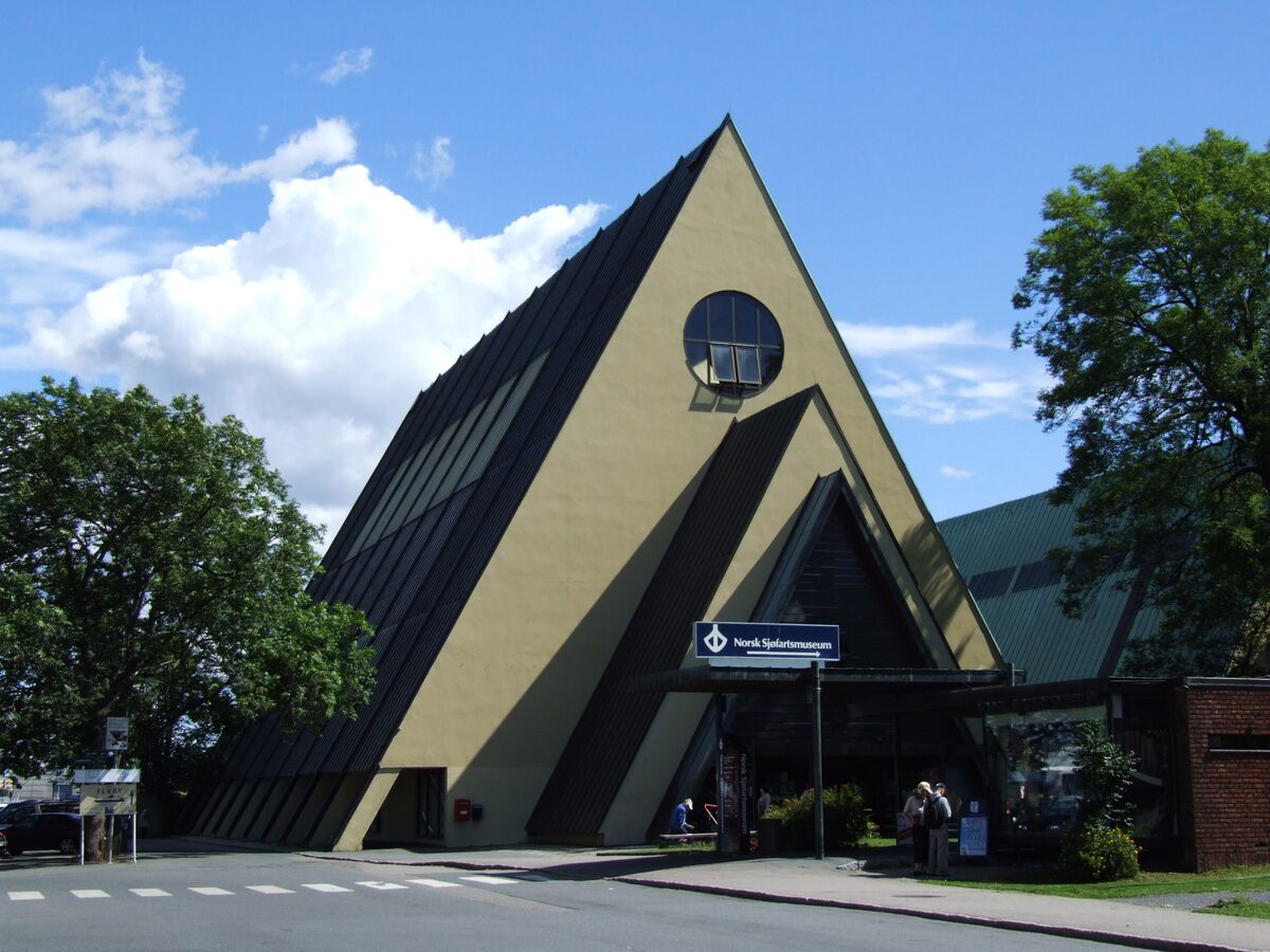 The tall triangular A-frame building of the Fram Museum on Bygdøy under a blue sky