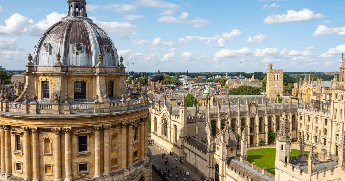 Aerial view of the Radcliffe Camera's dome in Oxford, with the spires and quadrangles of All Souls College and the old city around it