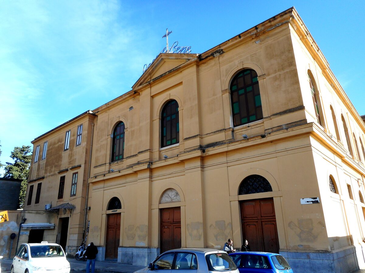 The yellow facade of the Capuchin church beside the catacomb entrance