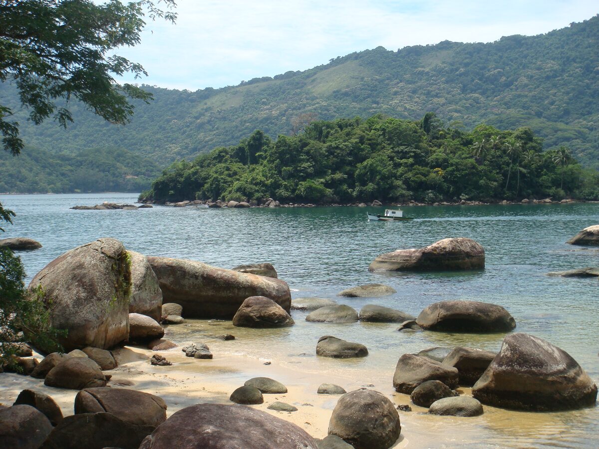 Granite boulders and a wooded island on the shore of Praia Preta on Ilha Grande