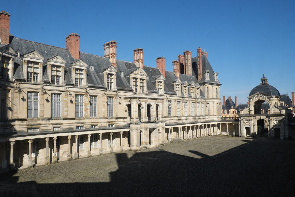 The Cour Ovale of the Château de Fontainebleau, with its arcaded wings and tall chimneys