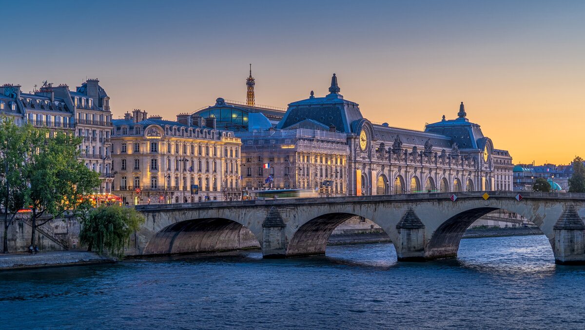 The Musée d'Orsay across the Seine from the Pont Royal, under an evening sky