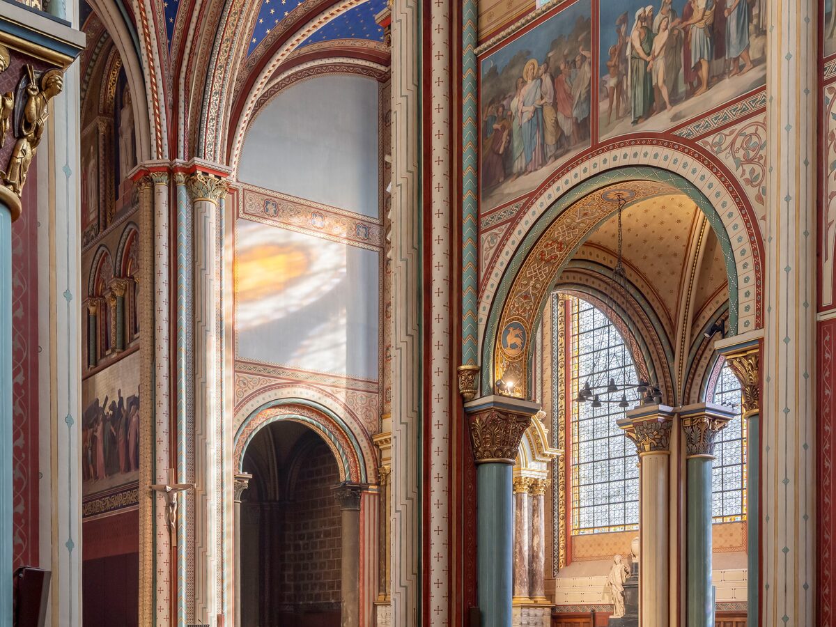 The nave of Saint-Germain-des-Prés, with its tall pale columns and stained-glass windows