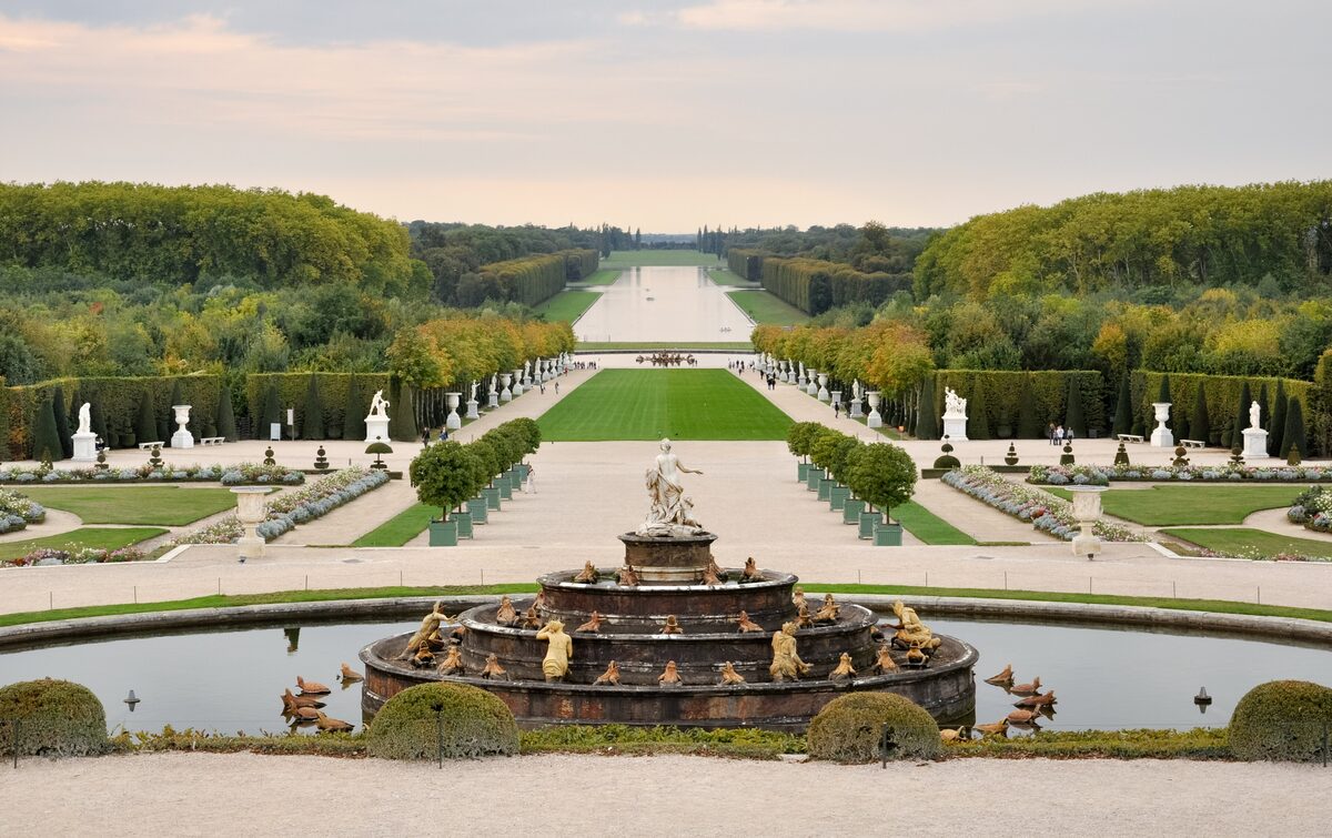 The gardens of Versailles seen from the Parterre d'Eau: the Latona fountain, clipped lawns and tree-lined avenues running to the Grand Canal