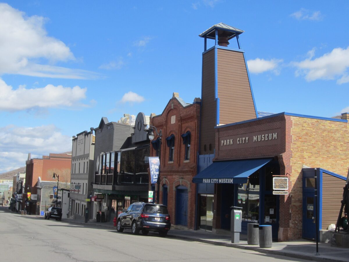 The Park City Museum on Main Street, with its brick bell tower and blue awning