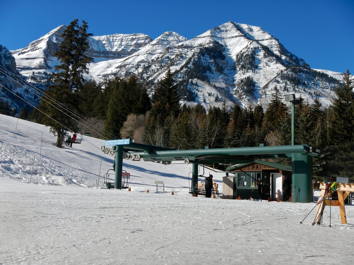 Snow-covered slopes and a chairlift at Sundance Resort, with the Wasatch peaks behind