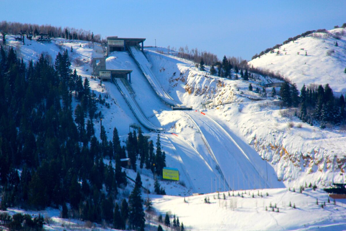 The ski jumps at Utah Olympic Park, their landing hills covered in snow