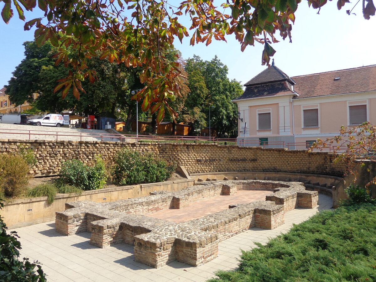 The excavated stone foundations of an early Christian burial building in a sunken courtyard near the cathedral in Pécs