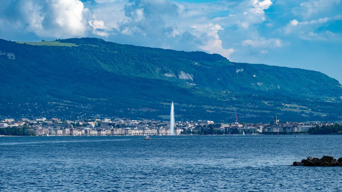 Geneva and its Jet d'Eau across the blue water of Lake Geneva