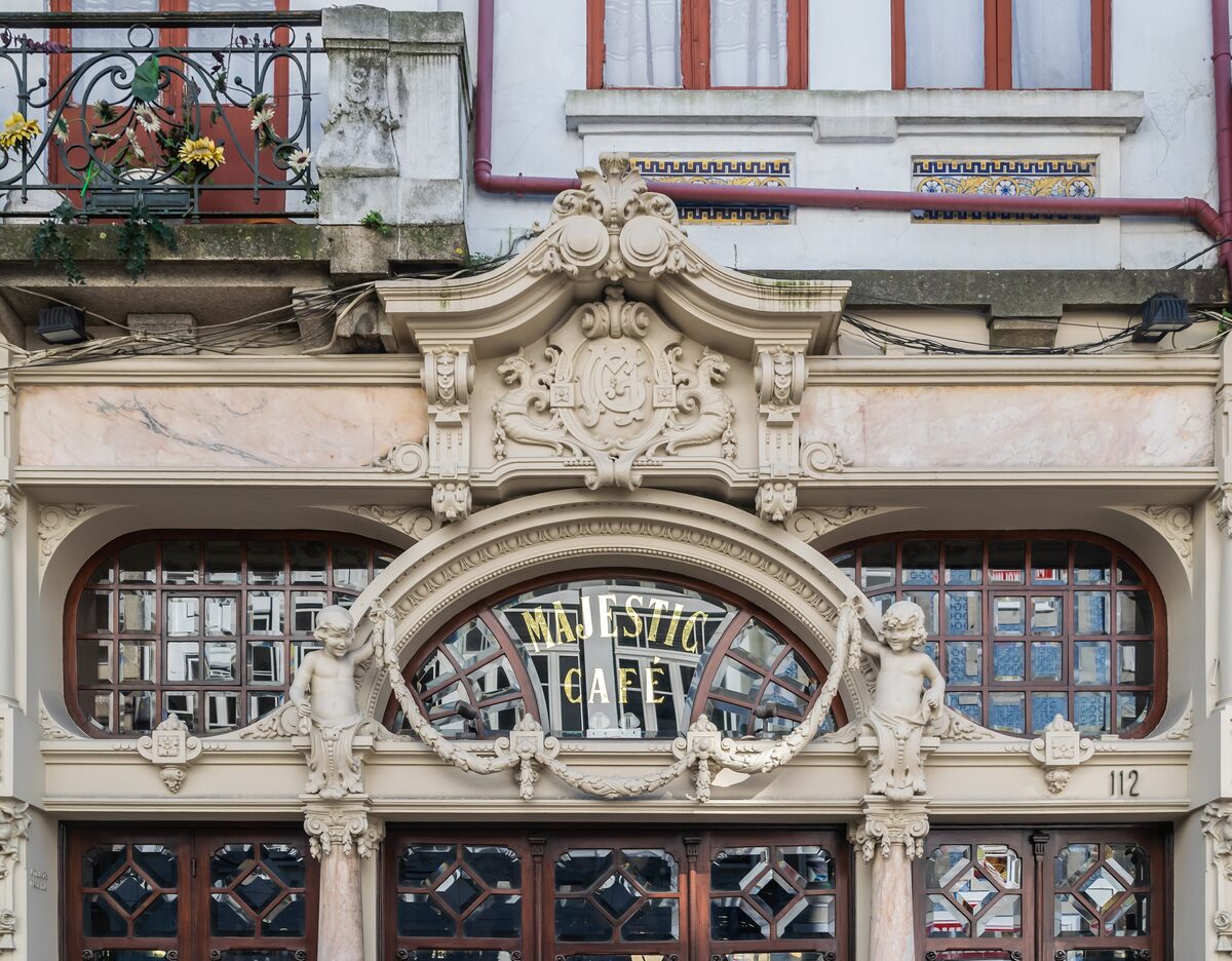 The Art Nouveau facade of Café Majestic, with ornate stone carving above the windows