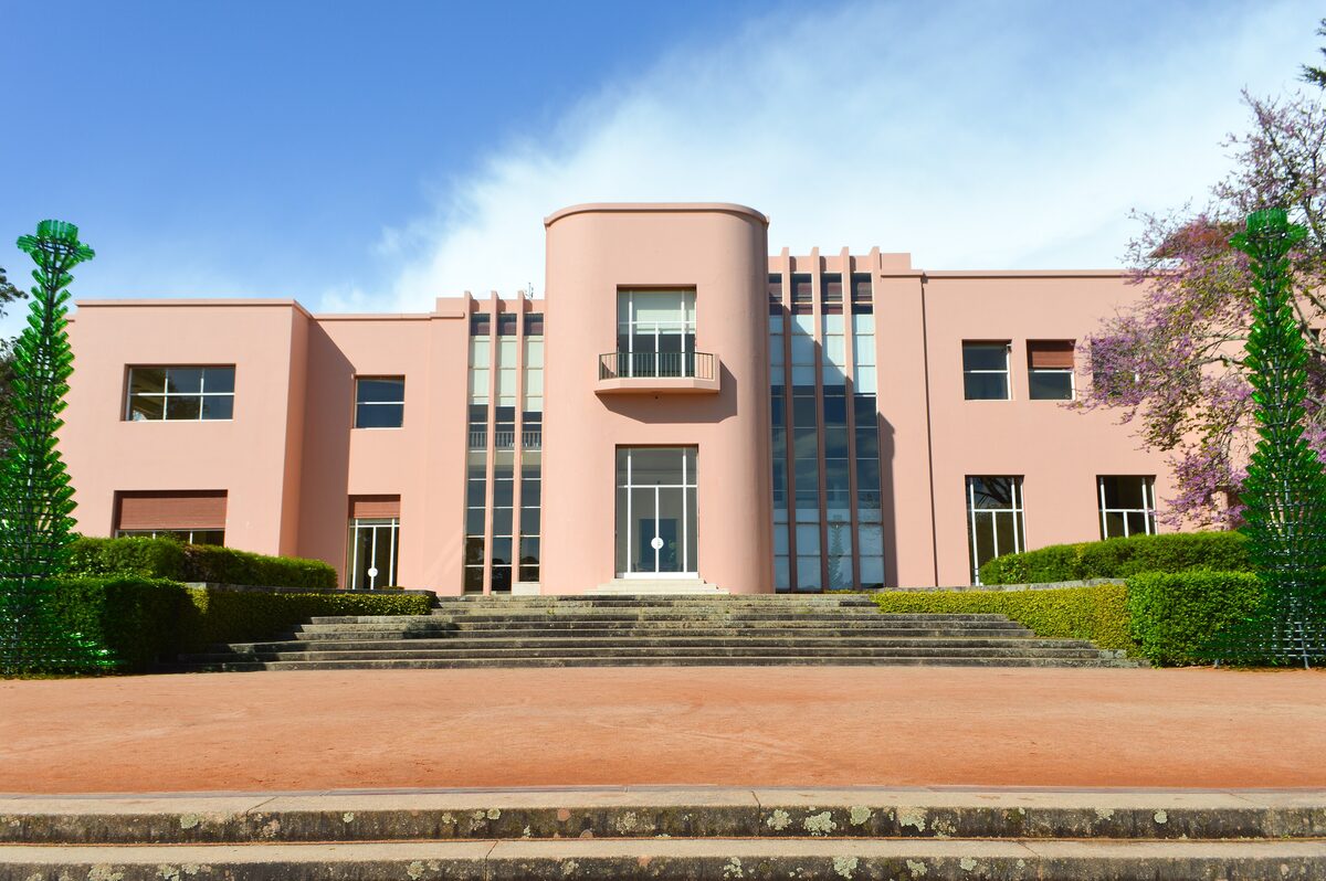 The pink Art Deco Casa de Serralves villa with its stepped garden and lawn in front