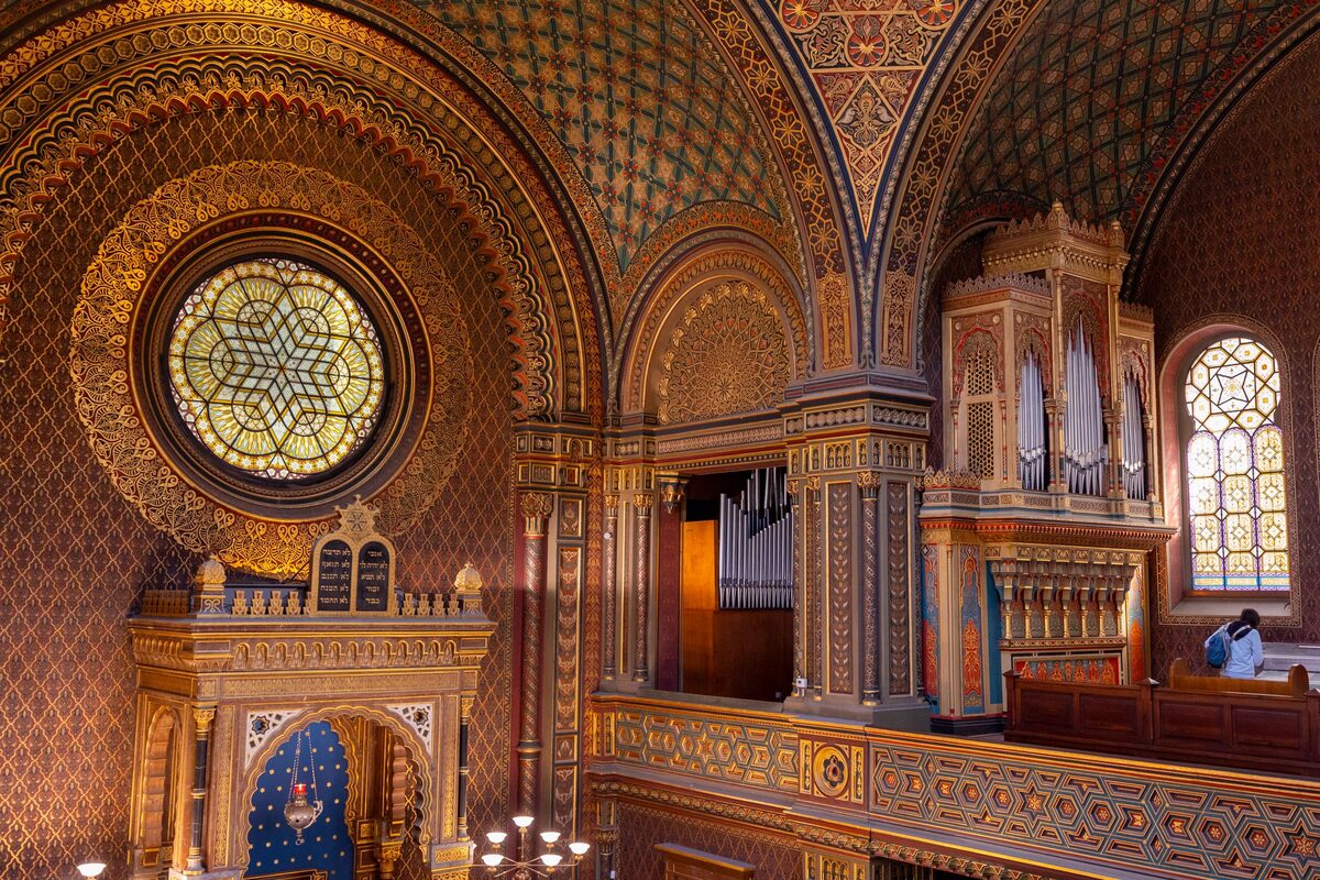 The painted interior of the Spanish Synagogue with its Moorish-style ceiling and rose window
