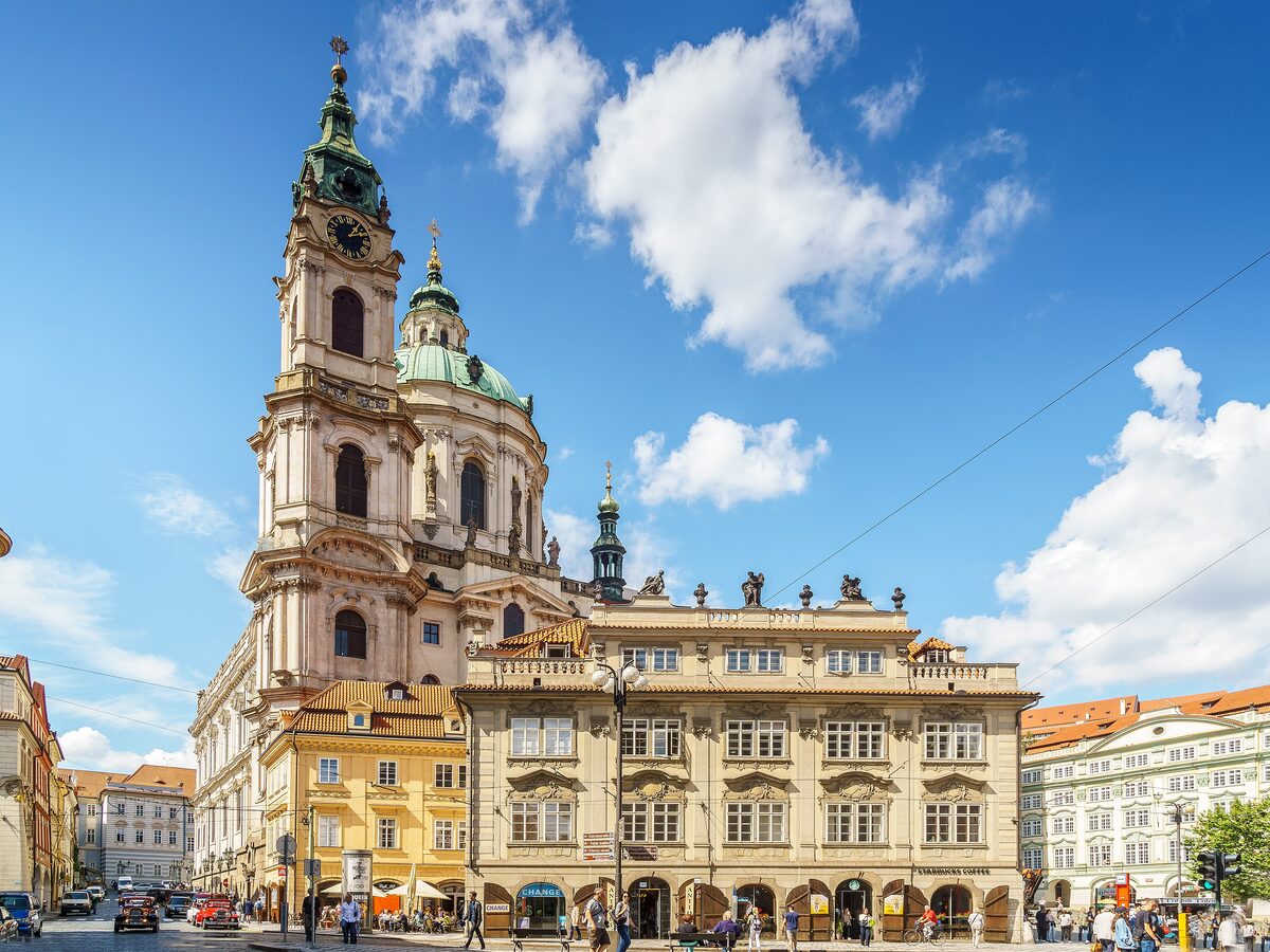 St. Nicholas Church in Mala Strana with its green dome and bell tower above the square